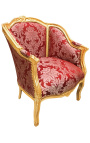 Grande bergère de style Louis XV satiné rouge aux motifs "Gobelins" et bois doré