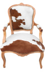 Baroque armchair of Louis XV style with real brown and white cowhide and raw wood