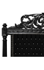 Barokkityylinen sängynpääty mustaa samettia strassilla ja mustalla lakatulla puulla.