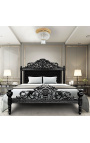Baročna postelja s črnim žametnim blagom z kamenčki in črno lakiranim lesom.