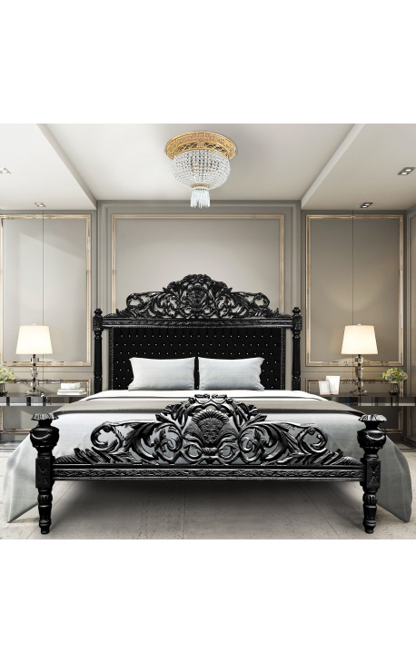 Baročna postelja s črnim žametnim blagom z kamenčki in črno lakiranim lesom.