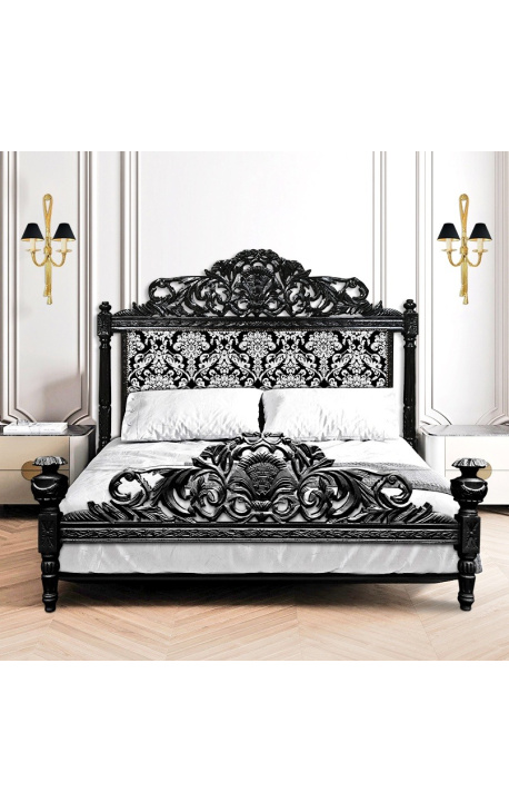 Barok bed met witte stof met bloemmotief en glanzend zwart hout