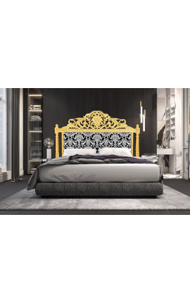 Zagłówek łóżka w stylu barokowym z białą tkaniną w kwiatowy wzór i złotym drewnem
