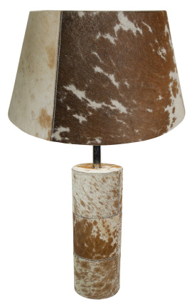 Ruskea ja valkoinen lehmännahkainen pyöreä lampun kanta