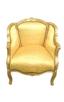 Grande bergère de style Louis XV tissu doré satiné et bois doré