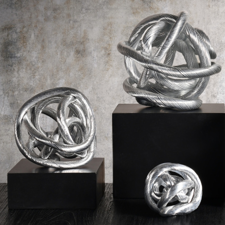 Infinity ribbon sculpture in bronze color in metal