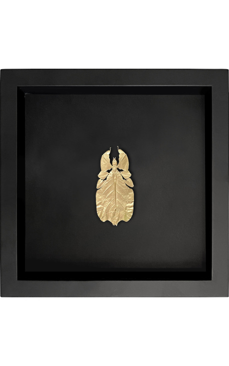 Dekorativ ram på svart bakgrund med gyllene stick insekt "Phyllium Celebicum"