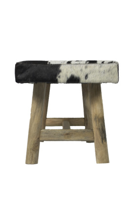 Banc en bois et peau de vache marron et blanc