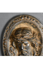Placa de guix policrom i daurat "Medalló de la Passió"