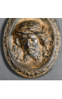 Polychrome and gilded plaster plaque "Medallion of the Passion"