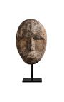 Large sculpture of wooden mask Timor on a stand