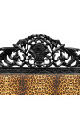 Cama barroca com tecido estampado de oncinha e madeira preta