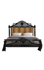 Barokinė lova su baltu gėlių rašto audiniu ir blizgia juoda mediena