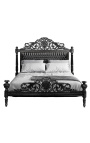 Barokní látková koženková postel s černými kamínky a černě lakovaným dřevem.