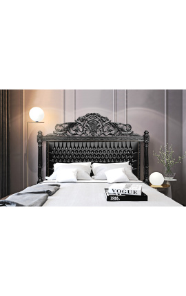 Barokki sängynpäädyn kangas tekonahka musta ja strassit mustaksi lakattua puuta.