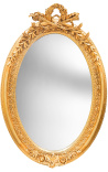 Very large golden vertical oval baroque mirror