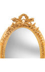 Very large golden vertical oval baroque mirror