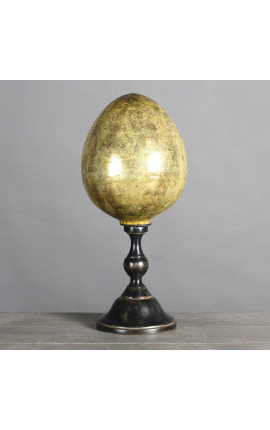 Grande uovo giallo in vetro soffiato su una base di legno intagliato nero