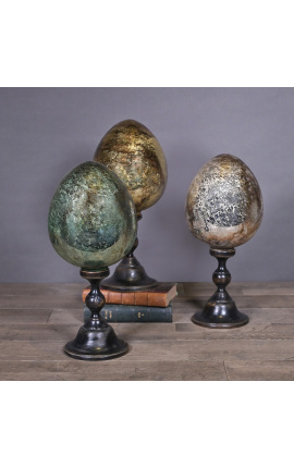 Grand oeuf argenté en verre soufflé sur socle en bois sculpté noir