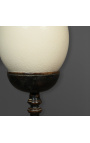 Ostrich egg on wooden baluster with square base