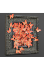 Czarna, patynowana, XIX-wieczna rama z lotem pomarańczowych motyli