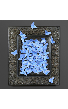 Cornice in stile patinato nero del XIX secolo con volo di farfalle blu