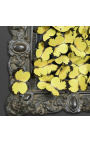 19th century black patinated style frame with flight of yellow butterflies