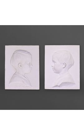 Pair of plaster child profile to be attached to the wall - negative and positive