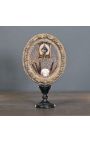 Quadro oval "Memento Mori no terceiro olho" apresentado na base de madeira