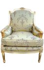 Grande bergère de style Louis XVI tissu satiné doré avec motifs et bois doré