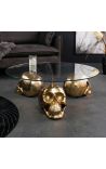 Round coffee table with golden death head and glass top