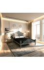 Cama barroca con tejido de terciopelo gris y madera lacada gris.
