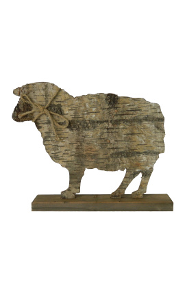 Sheep on wooden stand with bark and knot rope