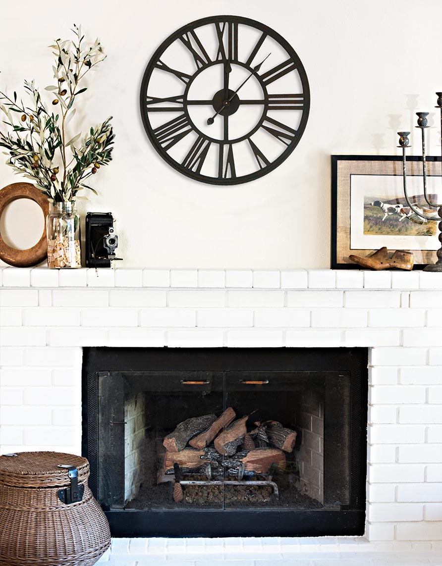 Large openwork clock style old factory Royal Art Palace placed over a fireplace